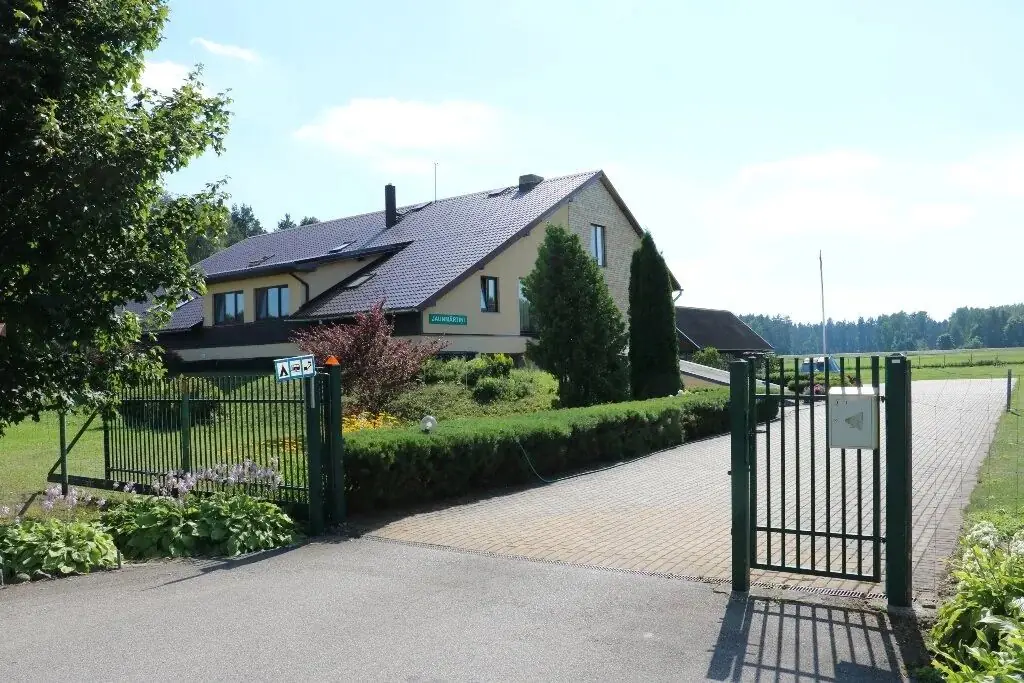 The guest house with its green gate
