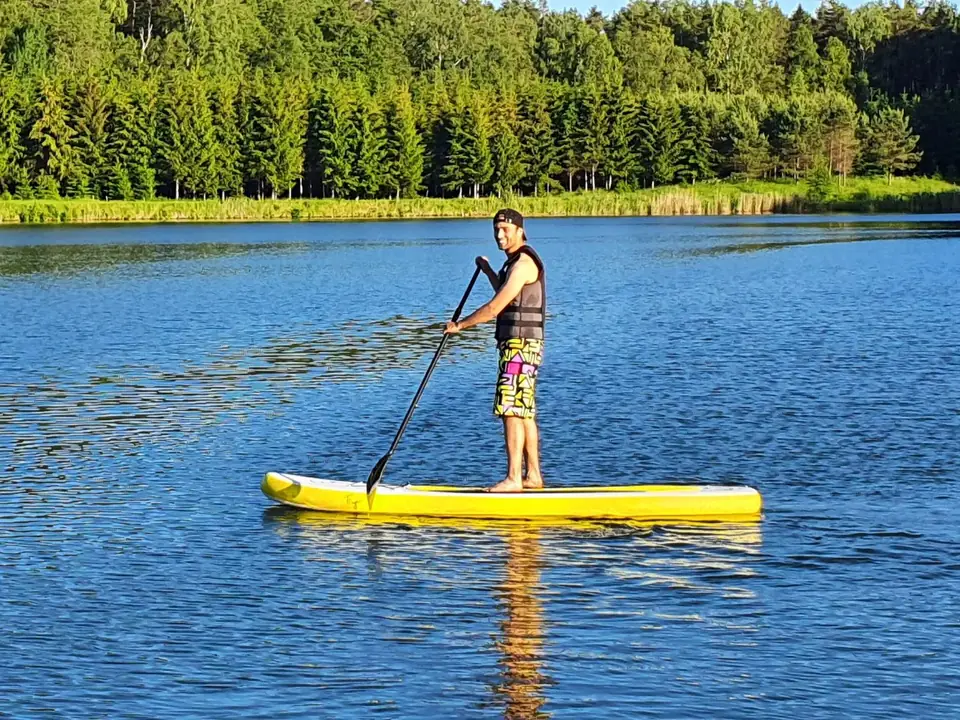 A paddleboarder on Lake Martiņu