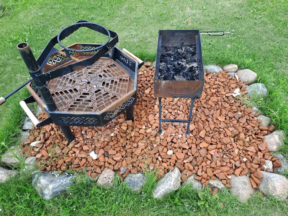 A grill and cauldron at the picnic spot